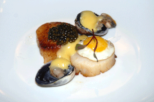 German Desietra Baerrii Caviar on Dayboat Scallop, Quail Egg, Cockles and Béarnaise Sauce