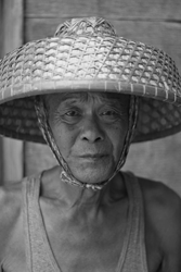 man with woven basket hat