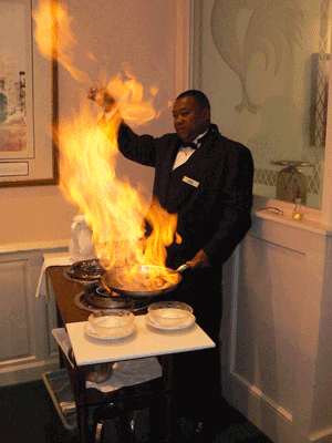 Ron Boykins flaming Bananas Foster in the old Brennans in New Orleans