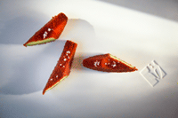  Avocado with tomato powder, olive oil, and fleur de sel