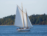 A gaff-rigged wooden sailboat