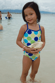 little girl with shell