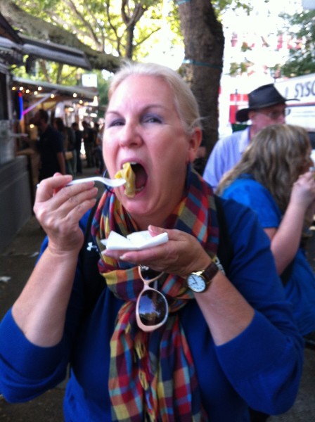 Chowing down on a cheeseburger dumpling.