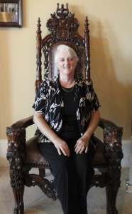 The author sitting on Bill Clinton's chair at Casa Monica Hotel