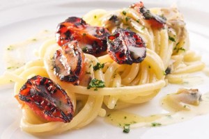 Uliassi's Smoked spaghetti with clams and grilled "pendolini" tomatoes