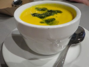 Carrot ginger soup with a dollop of salsa verde.