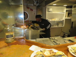 Busy at the grill producing dozens of Famous Flaming Oysters