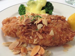 Fried black drum with toasted almonds and broccoli with a creamy sauce