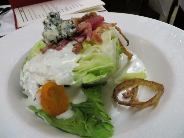 Wedge salad with bleu cheese and fried onions.